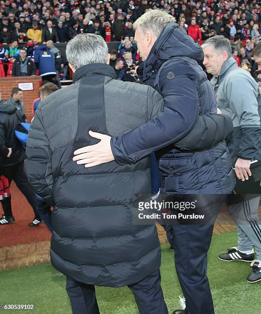 Manager Jose Mourinho of Manchester United greets Manager David Moyes of Sunderland ahead of the Premier League match between Manchester United and...