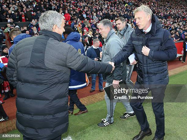 Manager Jose Mourinho of Manchester United greets Manager David Moyes of Sunderland ahead of the Premier League match between Manchester United and...