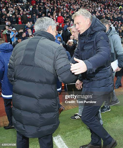 Manager Jose Mourinho of Manchester United greets Manager David Moyes of Sunderland ahead of the Premier League match between Manchester United and...