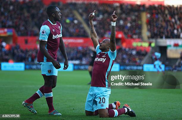 Andre Ayew of West Ham United celebrates scoring the opening goal with Michail Antonio of West Ham United during the Premier League match between...