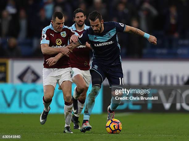 Alvaro Negredo of Middlesbrough holds off pressure from Dean Marney of Burnley during the Premier League match between Burnley and Middlesbrough at...