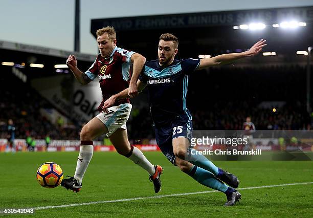 Scott Arfield of Burnley holds off the challenge of Calum Chambers of Middlesbrough during the Premier League match between Burnley and Middlesbrough...