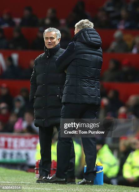 Manager Jose Mourinho of Manchester United shares a joke with Manager David Moyes of Sunderland during the Premier League match between Manchester...