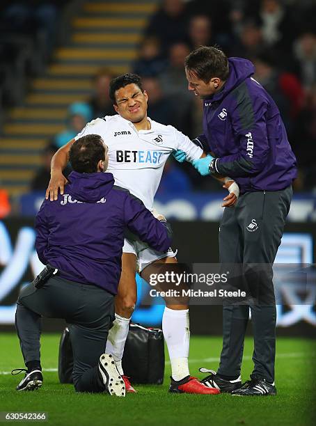 Jefferson Montero of Swansea City receives treatment during the Premier League match between Swansea City and West Ham United at Liberty Stadium on...