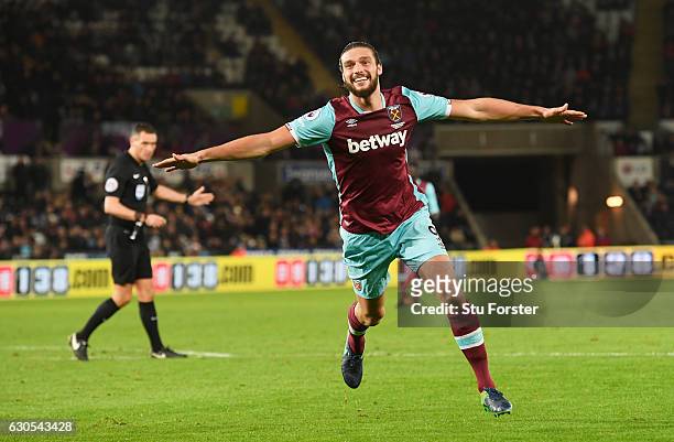 Andy Carroll of West Ham United celebrates scoring his team's fourth goal during the Premier League match between Swansea City and West Ham United at...
