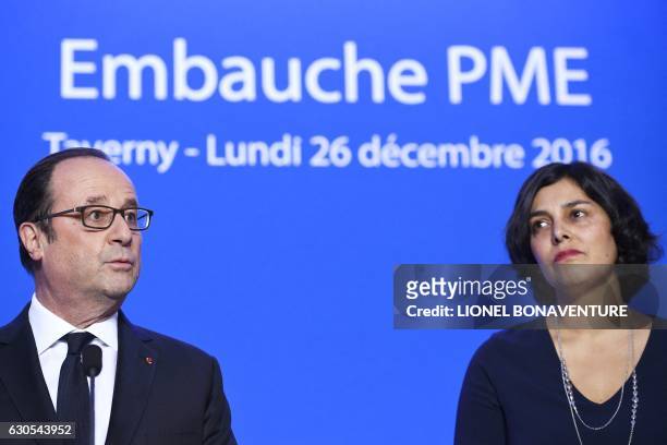 French President Francois Hollande delivers a speech next to French Labour Minister Myriam El Khomri during his visit of the French elevators company...