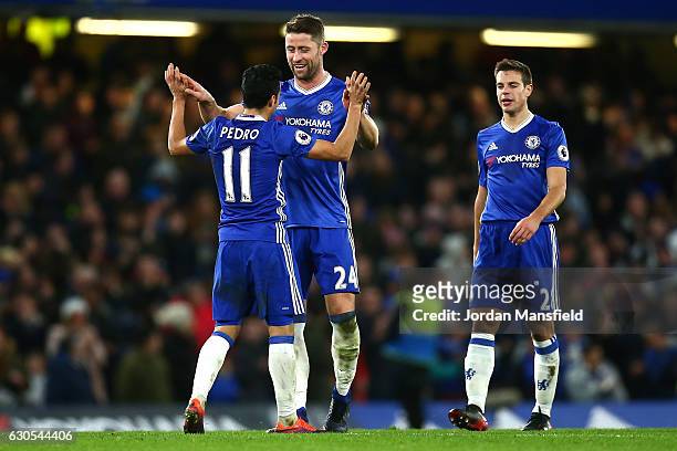Pedro of Chelsea celebrates with Gary Cahill of Chelsea after scoring his second and his sides third goal during the Premier League match between...