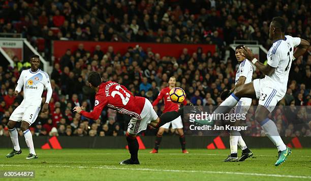 Henrikh Mkhitaryan of Manchester United scores his team's third goal during the Premier League match between Manchester United and Sunderland at Old...