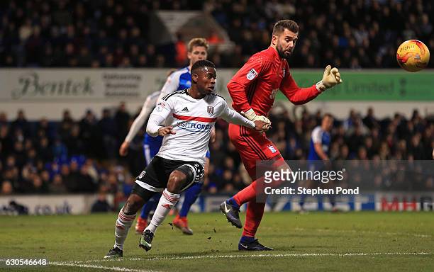 Bartosz Bialkowski of Ipswich Town and Floyd Ayite of Fulham compete for the ball during the Sky Bet Championship match between Ipswich Town and...