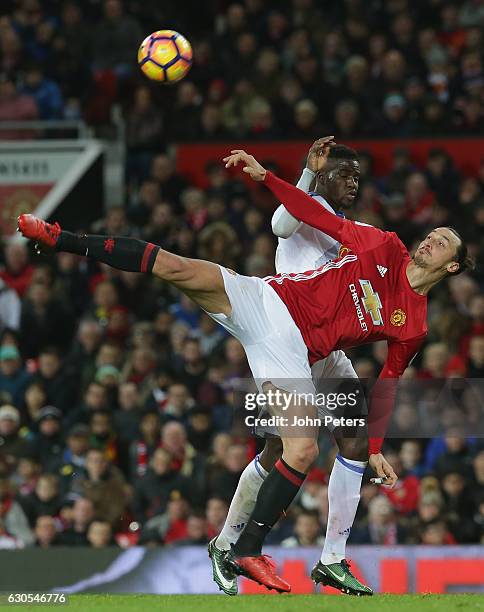 Zlatan Ibrahimovic of Manchester United in action with Lamine Kone of Sunderland during the Premier League match between Manchester United and...