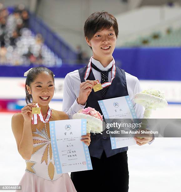 Gold medalists Riku Miura and Shoya Ichihashi pose for photographs at the medal ceremony for the Junior Pair during day two of the 85th All Japan...