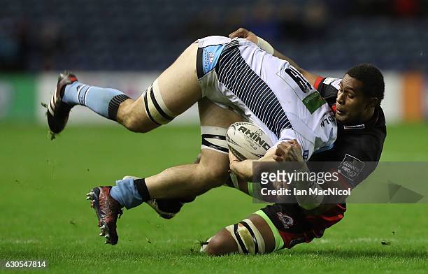 Viliame Mata of Edinburgh Rugby tackles Adam Ashe of Glasgow during the Guinness Pro 12 match between Edinburgh Rugby and Glasgow Warriors at...