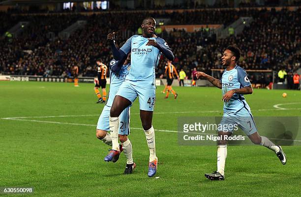 Yaya Toure of Manchester City celebrates scoring the opening goal with Raheem Sterling during the Premier League match between Hull City and...