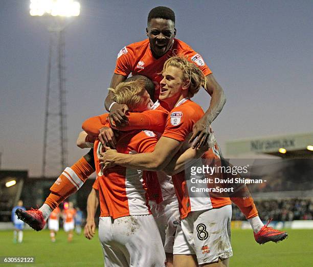 Blackpool's Mark Cullen is mobbed after scoring the opening goal of the game during the Sky Bet League Two match between Hartlepool United and...