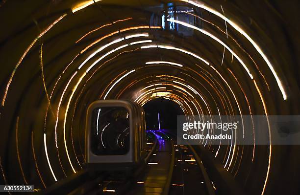 Shuttle train is seen through the Bund Sightseeing Tunnel in Shanghai, China on December 26, 2016. Bund Sightseeing Tunnel located between the...