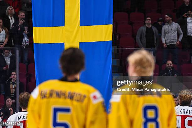 The Swedish flag is raised after Team Sweden defeated Team Denmark during the IIHF preliminary round game at the Bell Centre on December 26, 2016 in...