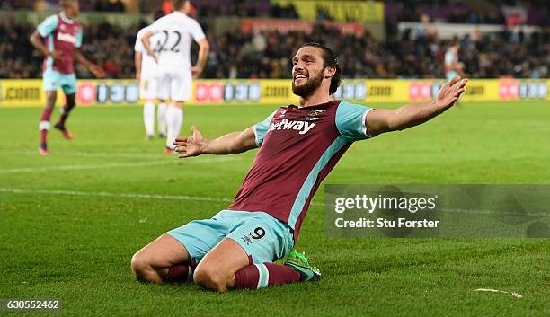 West Ham striker Andy Carroll celebrates after scoring the fourth West Ham goal during the Premier League match between Swansea City and West Ham...