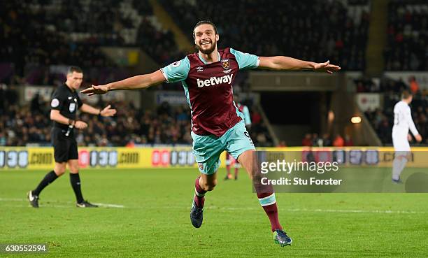 West Ham striker Andy Carroll celebrates after scoring the fourth West Ham goal during the Premier League match between Swansea City and West Ham...