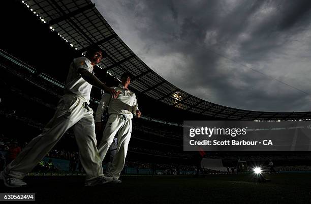 Vice-captain David Warner and captain Steven Smith of Australia lead their side onto the field during day two of the Second Test match between...