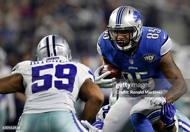 Eric Ebron of the Detroit Lions is hit by Anthony Hitchens of the Dallas Cowboys during the first half at AT&T Stadium on December 26, 2016 in...