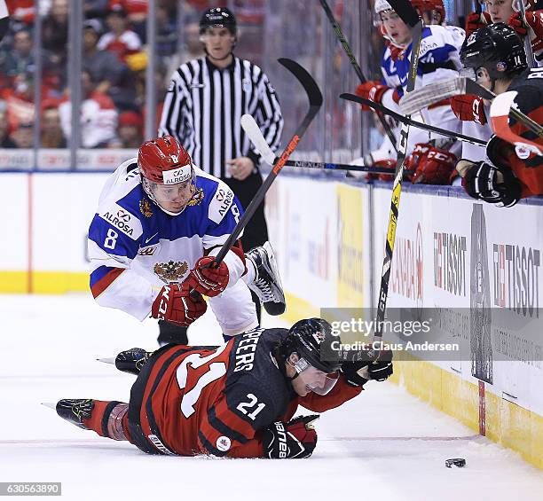 Kirill Urakov of Team Russia battles against Blake Speers of Team Canada during a game at the the 2017 IIHF World Junior Hockey Championships at the...