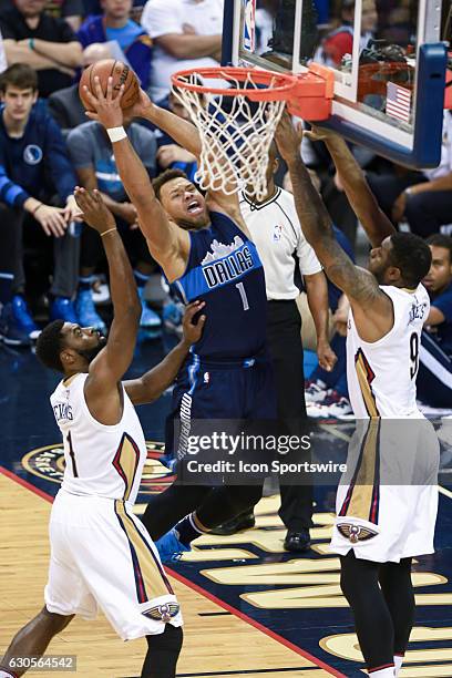 Dallas Mavericks guard Justin Anderson drives to the basket against New Orleans Pelicans forward Terrence Jones during the game between the New...