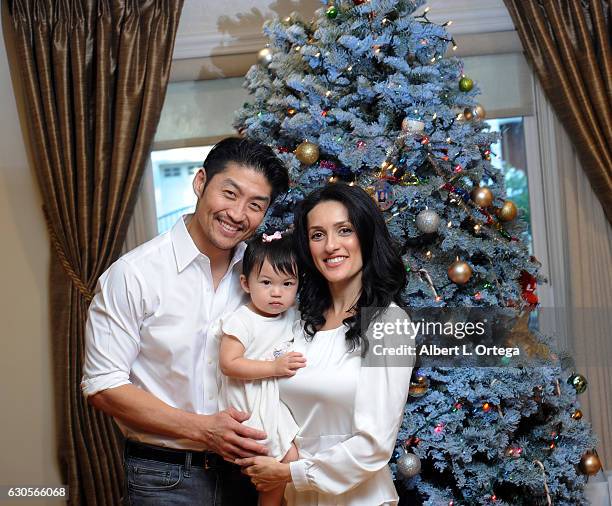 Actor Brian Tee of NBC's "Chicago Med", wife/actress Mirelly Taylor and daughter Madeline Skyer Tee pose in front of the Christmas Tree on December...
