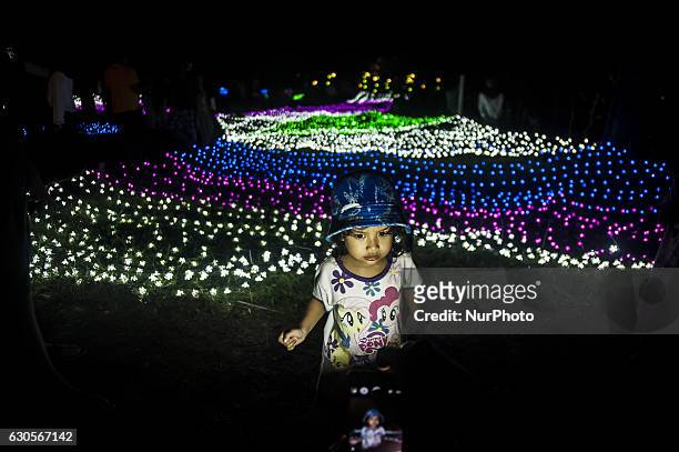 Child enjoyed the Festival of Lights in Kaliurang, Yogyakarta, Indonesia on December 26, 2016. This events to attract tourists both domestic and...