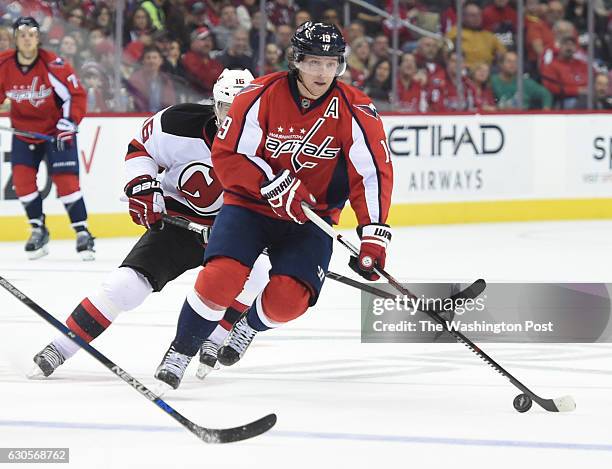 Washington Capitals center Nicklas Backstrom passes the puck against the New Jersey Devils on February 20, 2016 in Washington, DC.