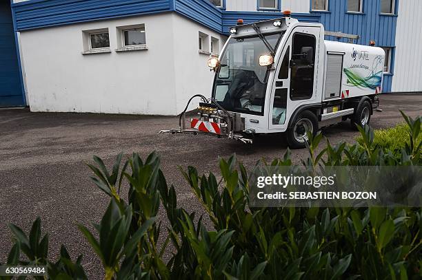 Man drives the LEV1200 electric washer at the Val air workshop on November 24, 2016 in La Cote. Mayor of Paris' determination to ban diesel from the...