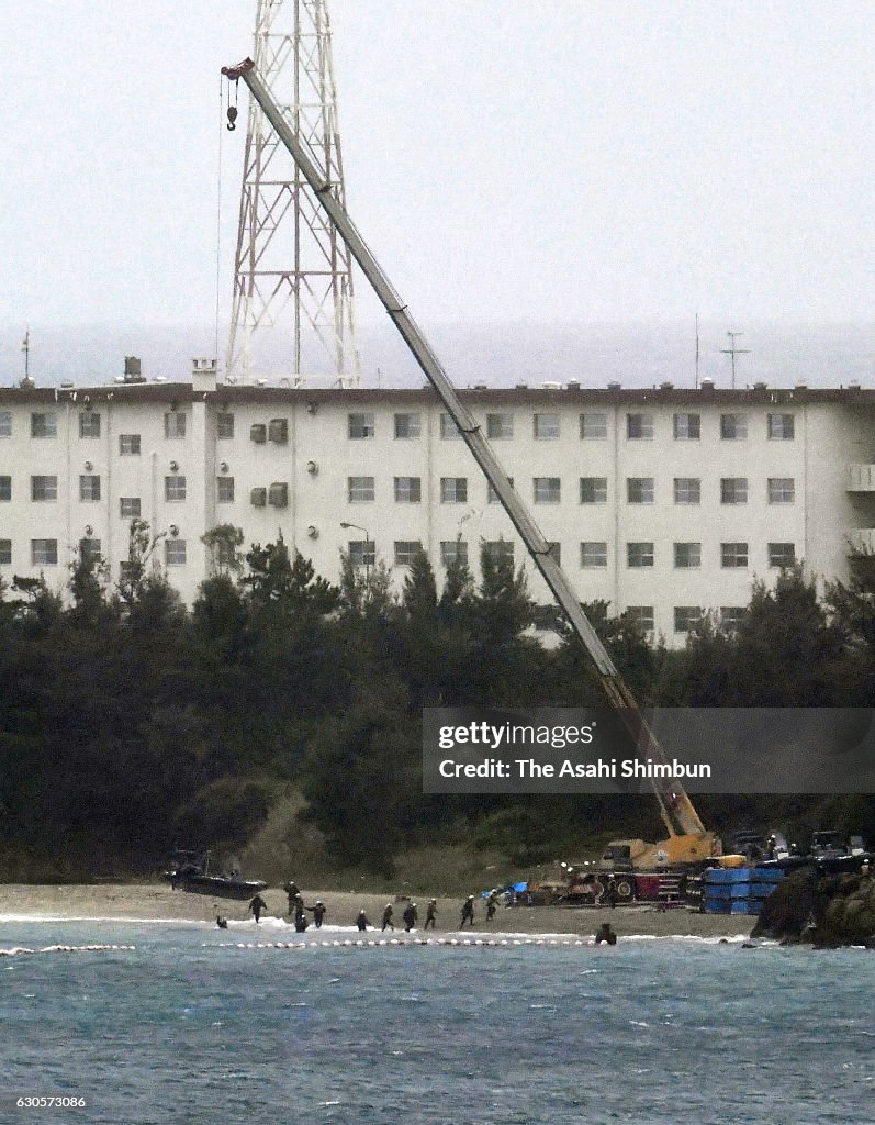 Henoko Project A crane appears at a beach of Henoko in preparation to resume the of ...