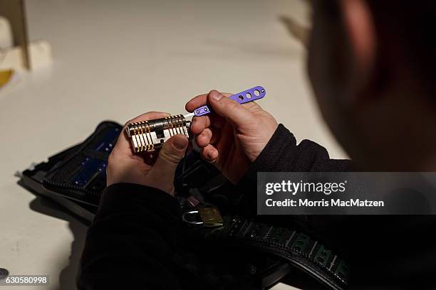 Participant is picking a lock during the 33rd Chaos Communication Congress on its opening day on December 27, 2016 in Hamburg, Germany. The annual...