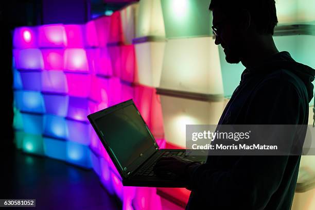 Participant poses in front of a LED-Wall during the 33rd Chaos Communication Congress on its opening day on December 27, 2016 in Hamburg, Germany....