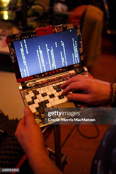 Participant poses with his laptop next to his 3D printer during the 33rd Chaos Communication Congress on its opening day on December 27, 2016 in...