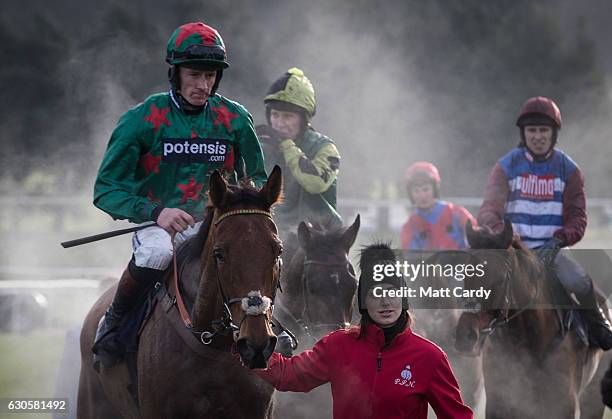Horses are led back to the parade ground following the first race during the 2016 Coral Welsh Grand National at Chepstow Racecourse on December 27,...