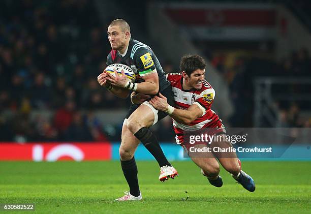 Mike Brown of Harlequins is tackled by James Hook of Gloucester during the Aviva Premiership Big Game 9 match between Harlequins and Gloucester Rugby...