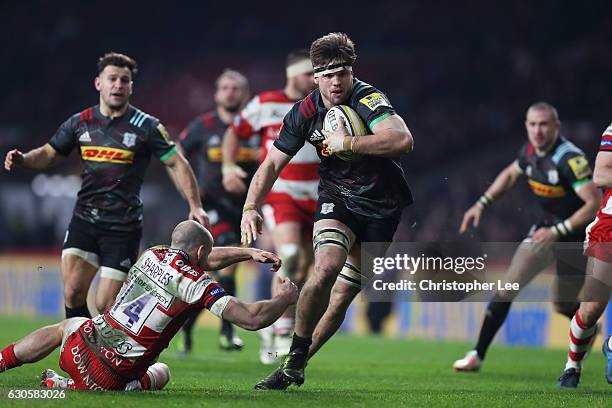Jack Clifford of Harlequins breaks past Charlie Sharples of Gloucester to score his team's second try during the Aviva Premiership Big Game 9 match...