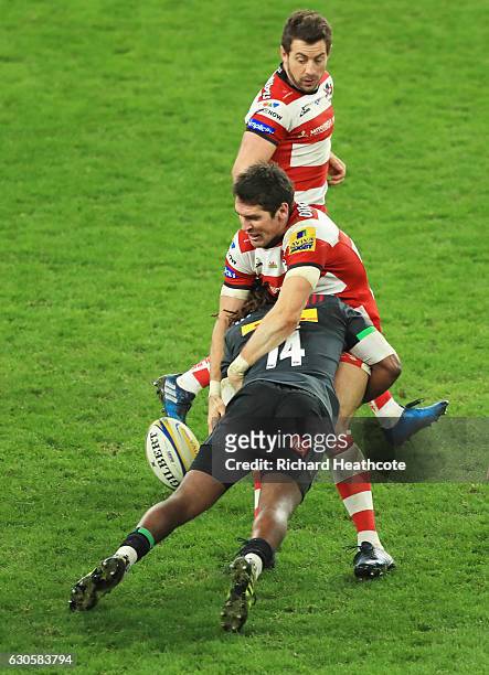 James Hook of Gloucester is tackled by Marland Yarde of Harlequins during the Aviva Premiership Big Game 9 match between Harlequins and Gloucester...