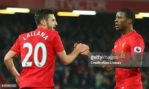 Adam Lallana of Liverpool celebrates with Georginio Wijnaldum as he scores their first goal during the Premier League match between Liverpool and...