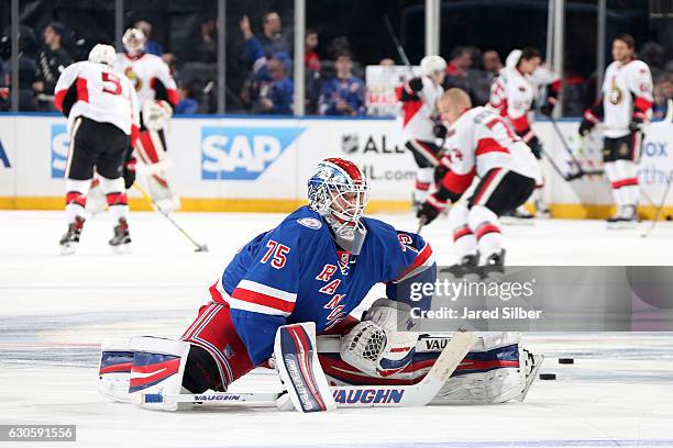 Brandon Halverson of the New York Rangers stretches during warmups before the game against the Ottawa Senators at Madison Square Garden on December...