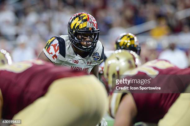 Terrapins defender peers across the Eagles offensive line during the Quick Lane Bowl between Maryland and Boston College on December 26 at Ford Field...