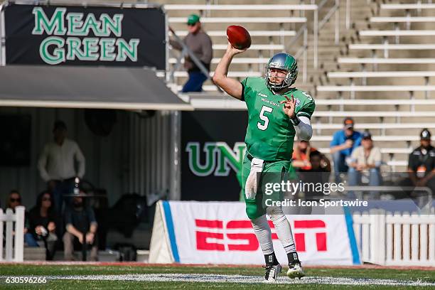 North Texas Mean Green quarterback Alec Morris throws a pass off his back foot during the Zaxby's Heart of Dallas Bowl between the Army West Point...