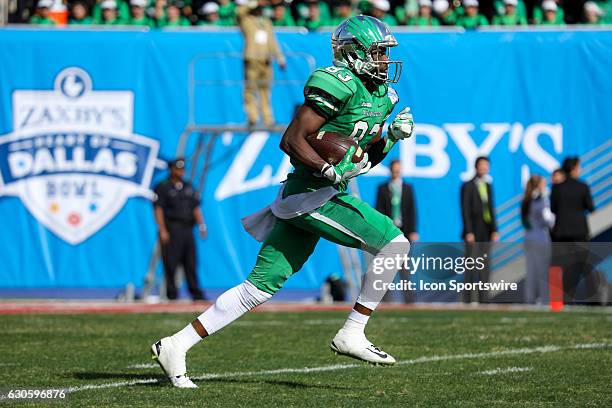 North Texas Mean Green wide receiver Tyler Wilson returns a kickoff during the Zaxby's Heart of Dallas Bowl game between the Army Black Knights and...