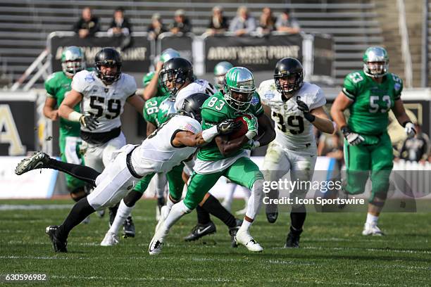 North Texas Mean Green wide receiver Tyler Wilson breaks a tackle during the Zaxby's Heart of Dallas Bowl game between the Army Black Knights and...