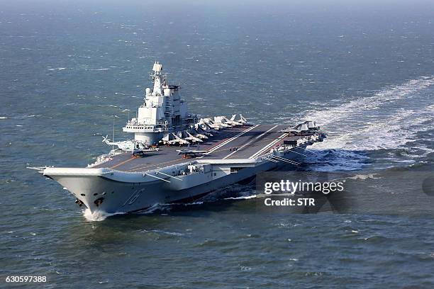 This photo taken on December 24, 2016 shows the Liaoning, China's only aircraft carrier, sailing during military drills in the Pacific. Taiwan's...