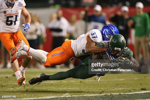 Wide receiver Ishmael Zamora of the Baylor Bears dives into the end zone under safety Cameron Hartsfield of the Boise State Broncos to score a 14...