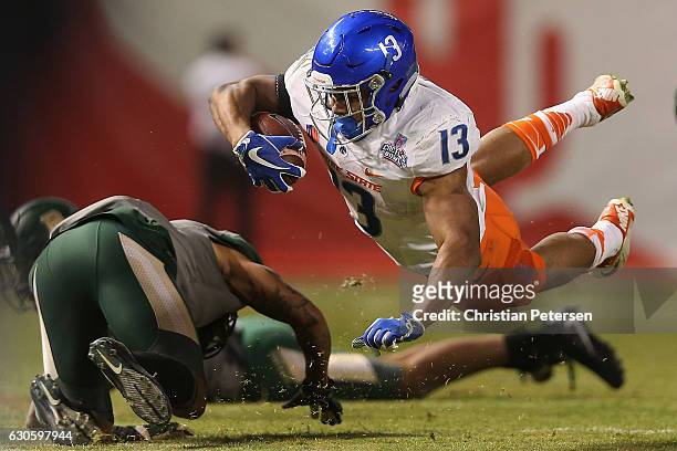 Running back Jeremy McNichols of the Boise State Broncos dives with the football after a reception against the Baylor Bears during the third quarter...