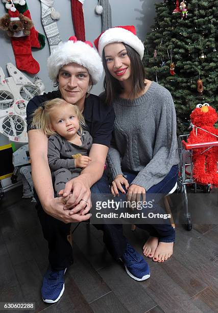 Actor Jason Mewes of "Jay & Silent Bob" poses with his wife Jordan Monsanto and daughter Logan in front of their Christmas Tree on December 27, 2016...