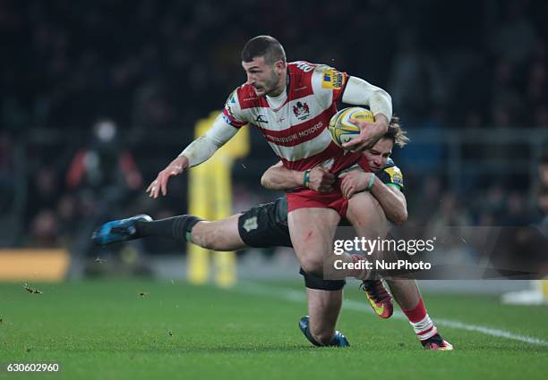 Jonny May of Gloucester gets tackled by Harlequins Ruaridh Jackson during Aviva Premiership Rugby match between Harlequins and Gloucester Rugby at...