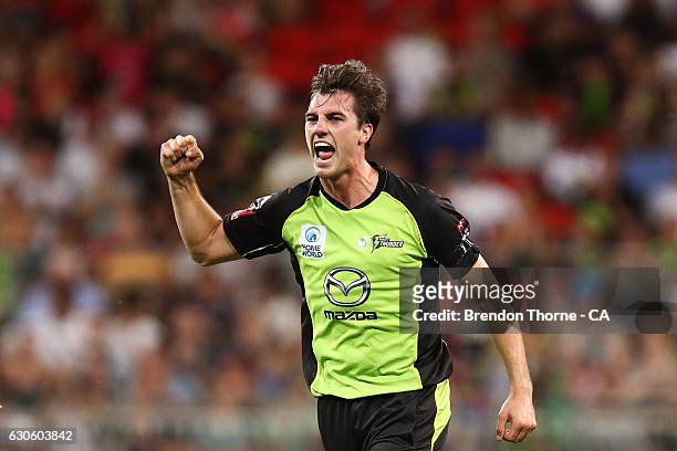 Pat Cummins of the Thunder celebrates after claiming the wicket of Alex Ross of the Heat during the Big Bash League match between the Sydney Thunder...